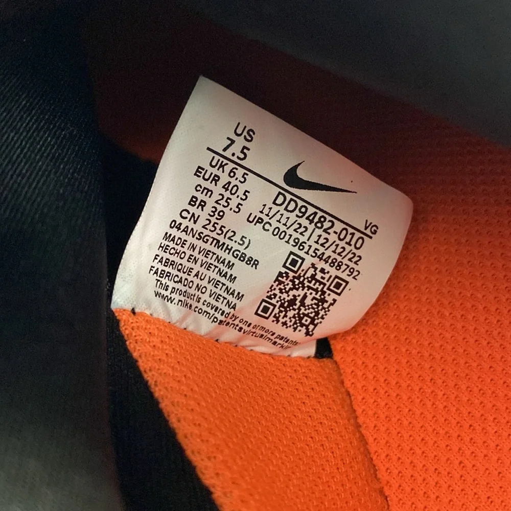 Nike Men’s Black Soccer Cleats with Bright Orange Studs